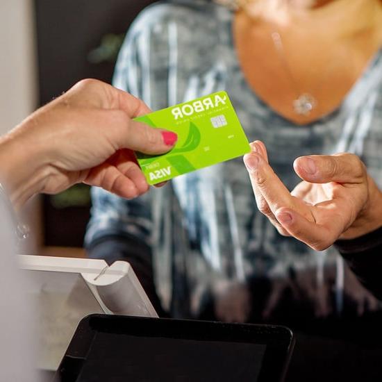 Customer using an Arbor debit card to make a payment.